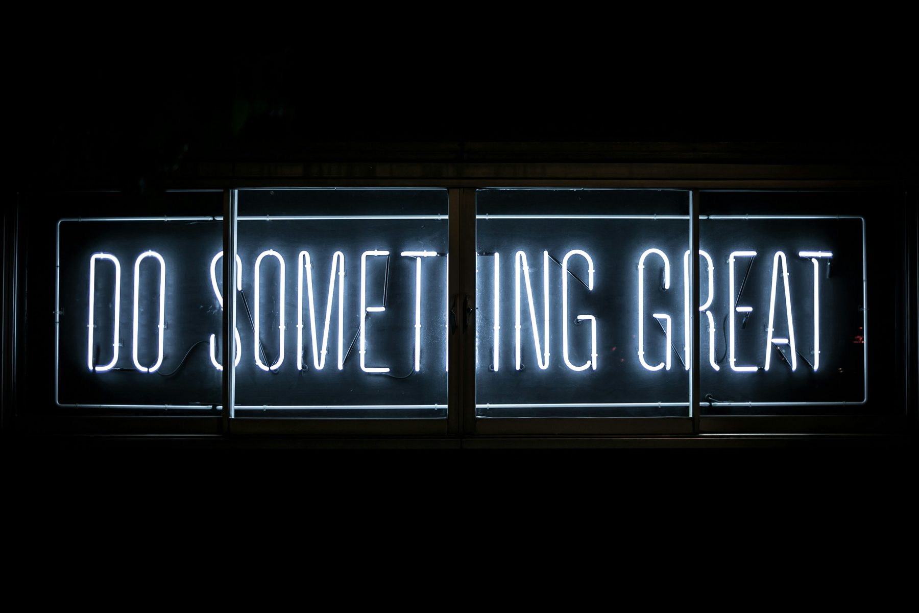 Neon sign reading Do Something Great