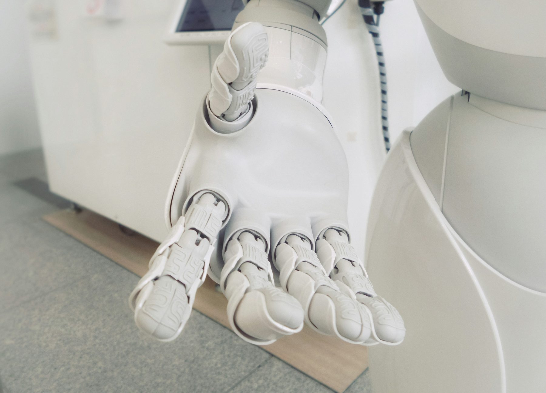 An open robotic hand, palm up